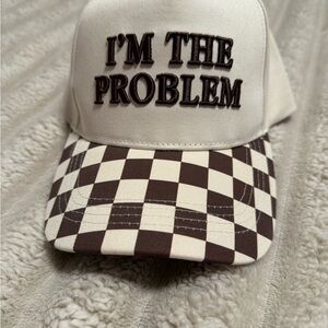 Buckle Beige and Brown "I'm The Problem" Checkerboard Trucker Hat